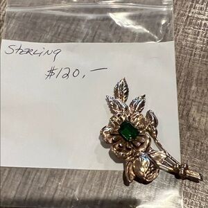 Elegant Sterling Silver Floral Brooch with Green Gem